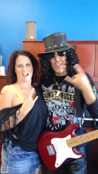 A hot Groupie Hanging all over Slash!