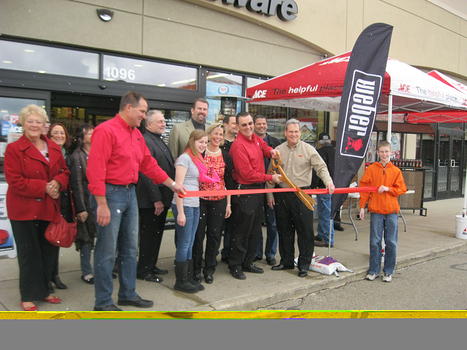 Dan Harris cuts Grand Opening Ribbon